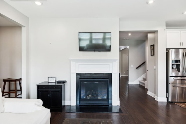 633 Fall Creek Cir, Goodlettsville, TN 37072 - living area featuring dark wood-style flooring, stairway, recessed lighting, a glass covered fireplace, and baseboards