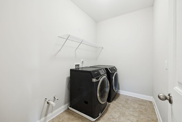 633 Fall Creek Cir, Goodlettsville, TN 37072 - laundry area with washing machine and dryer and baseboards
