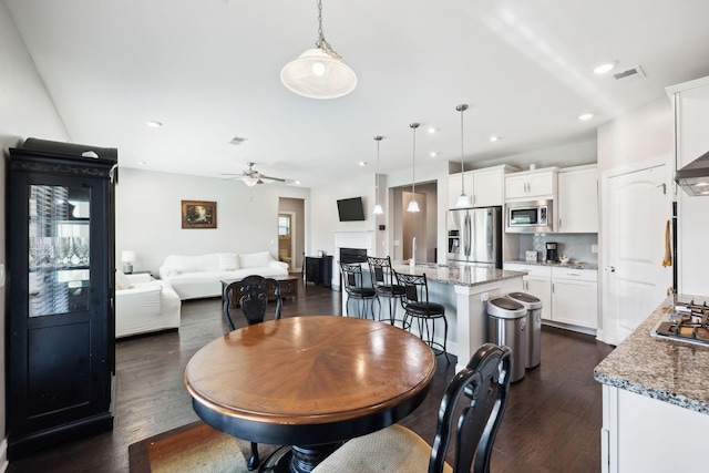 633 Fall Creek Cir, Goodlettsville, TN 37072 - dining area with dark wood-type flooring, ceiling fan, and recessed lighting