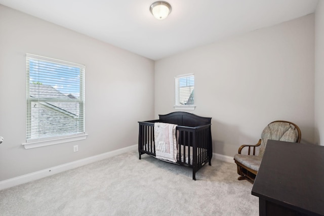 633 Fall Creek Cir, Goodlettsville, TN 37072 - bedroom with light colored carpet, baseboards, and a crib
