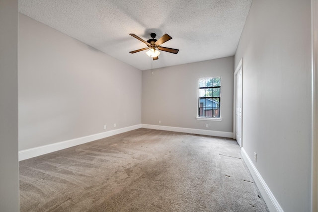 504 Macfie Ct, Madison, TN 37115 - spare room featuring carpet flooring, a textured ceiling, a ceiling fan, and baseboards