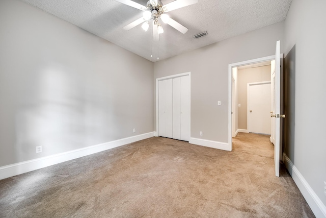 504 Macfie Ct, Madison, TN 37115 - unfurnished bedroom featuring carpet, a textured ceiling, a closet, baseboards, and ceiling fan