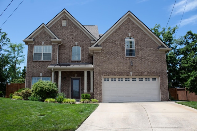 173 Tulip Grove Pt, Hermitage, TN 37076 - traditional-style home with brick siding, concrete driveway, and a garage