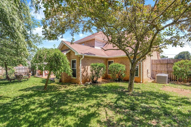 814 Riata Ct, Smyrna, TN 37167 - view of front of house with brick siding, central air condition unit, and a shingled roof