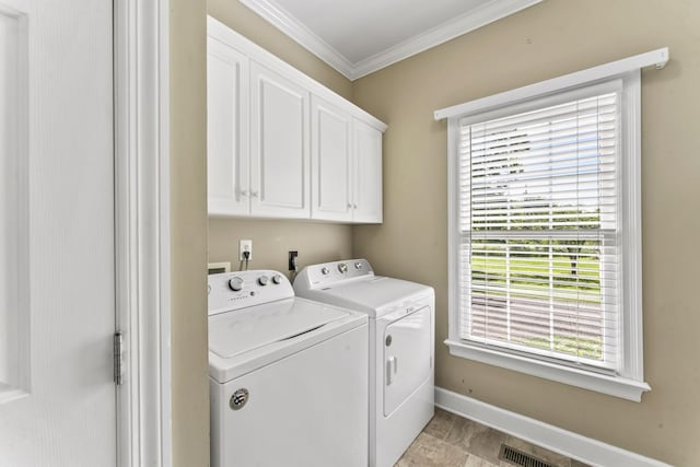 3000 General Forrest Dr, Columbia, TN 38401 - laundry area featuring washing machine and dryer, cabinet space, ornamental molding, and baseboards