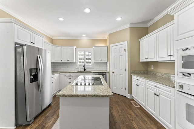 3000 General Forrest Dr, Columbia, TN 38401 - kitchen with stainless steel appliances, crown molding, a sink, white cabinets, and a center island