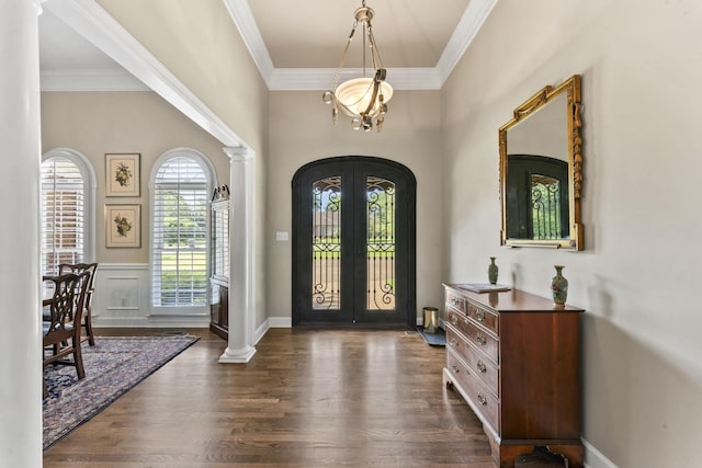 3000 General Forrest Dr, Columbia, TN 38401 - foyer with french doors, arched walkways, ornamental molding, dark wood-style floors, and wainscoting
