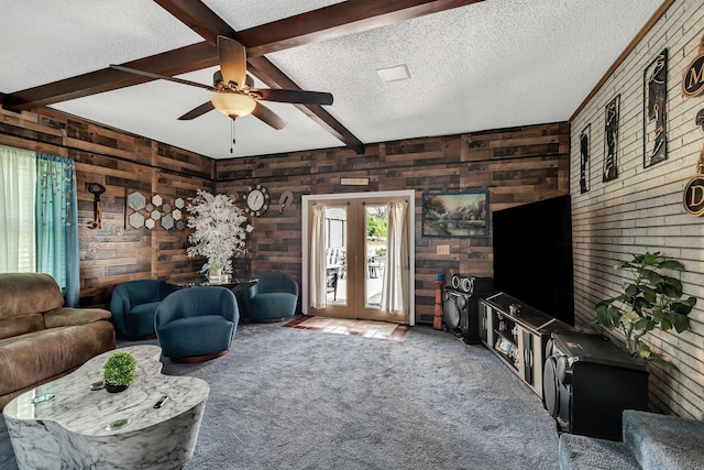 3109 Stokers Ln, Nashville, TN 37218 - carpeted living area featuring beamed ceiling, a textured ceiling, a ceiling fan, wooden walls, and french doors