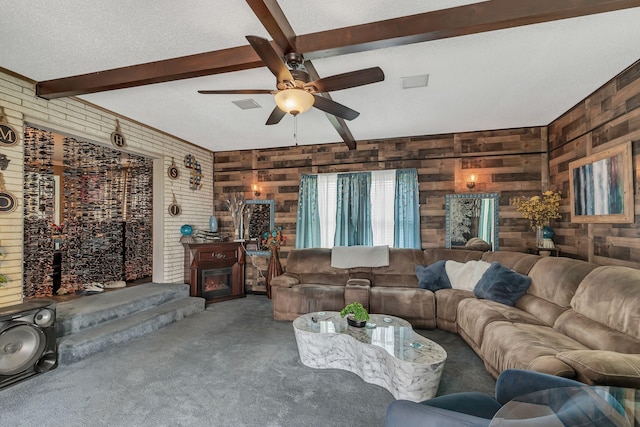 3109 Stokers Ln, Nashville, TN 37218 - living room featuring beam ceiling, wooden walls, carpet, a ceiling fan, and a fireplace