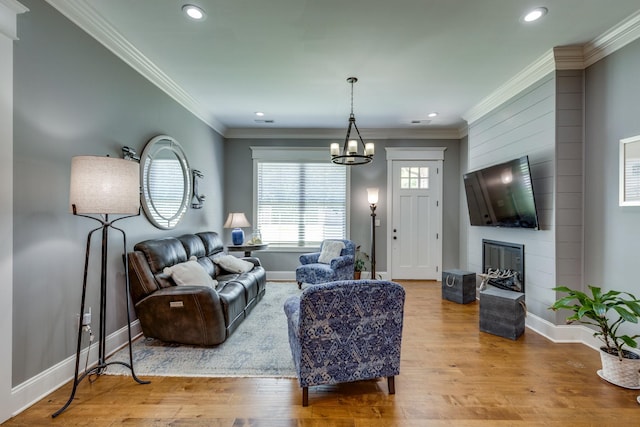 105 Andrews Dr, Loretto, TN 38469 - living area with a chandelier, baseboards, wood finished floors, recessed lighting, and crown molding