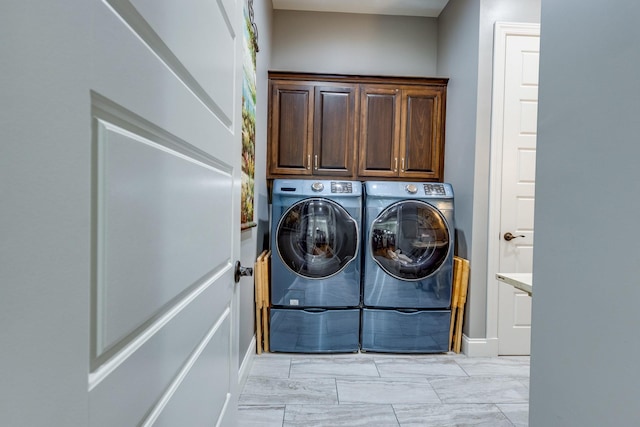105 Andrews Dr, Loretto, TN 38469 - laundry area with separate washer and dryer, cabinet space, and baseboards