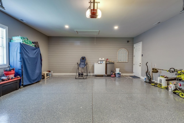 105 Andrews Dr, Loretto, TN 38469 - garage with baseboards, a garage door opener, and recessed lighting
