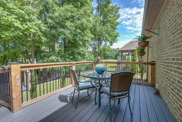 105 Andrews Dr, Loretto, TN 38469 - wooden deck with outdoor dining space
