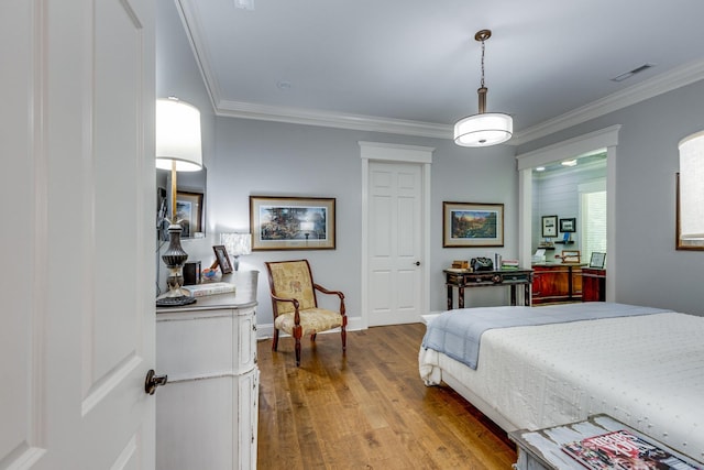 105 Andrews Dr, Loretto, TN 38469 - bedroom featuring wood finished floors, ornamental molding, and baseboards