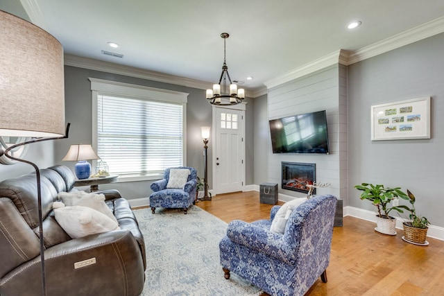 105 Andrews Dr, Loretto, TN 38469 - living room with a chandelier, wood finished floors, baseboards, ornamental molding, and recessed lighting