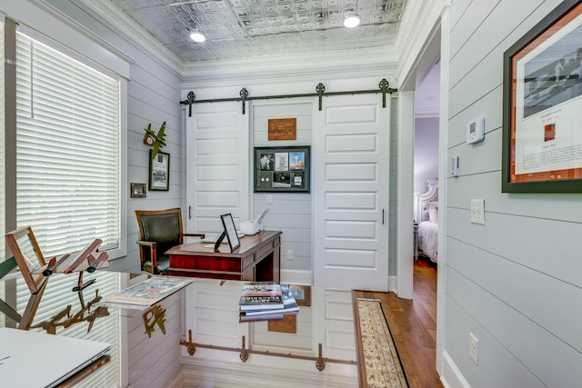 105 Andrews Dr, Loretto, TN 38469 - home office with a barn door, an ornate ceiling, wood finished floors, and ornamental molding