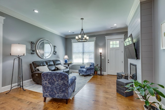 105 Andrews Dr, Loretto, TN 38469 - living room featuring a chandelier, baseboards, light wood-type flooring, ornamental molding, and recessed lighting