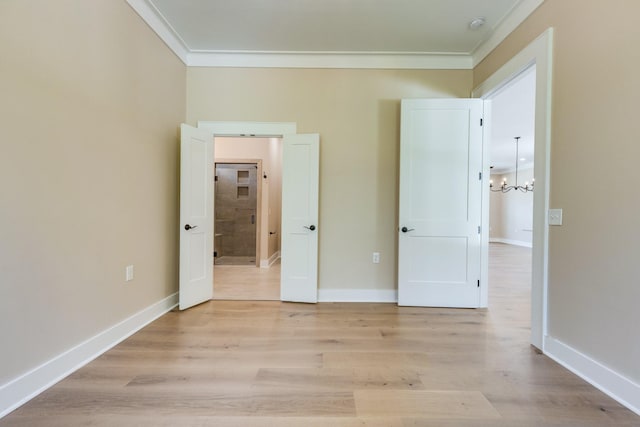 110 4th Ave S, Loretto, TN 38469 - unfurnished bedroom featuring ornamental molding, a chandelier, light wood-type flooring, and baseboards