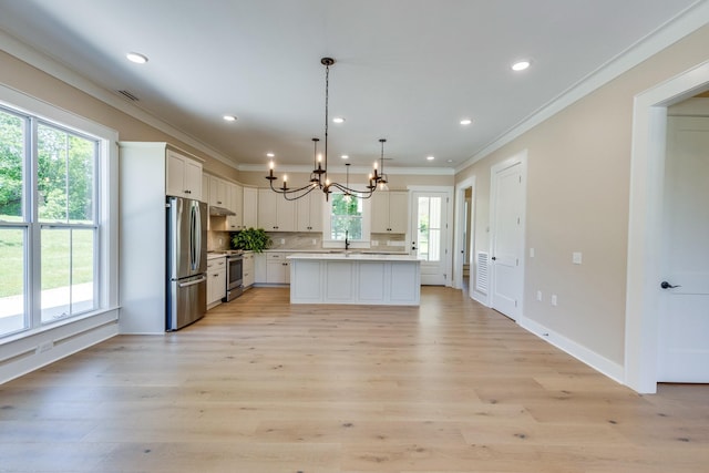110 4th Ave S, Loretto, TN 38469 - kitchen featuring a chandelier, ornamental molding, stainless steel appliances, a sink, and light countertops