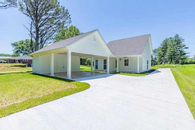 110 4th Ave S, Loretto, TN 38469 - modern inspired farmhouse featuring concrete driveway, a front lawn, board and batten siding, an attached carport, and a shingled roof