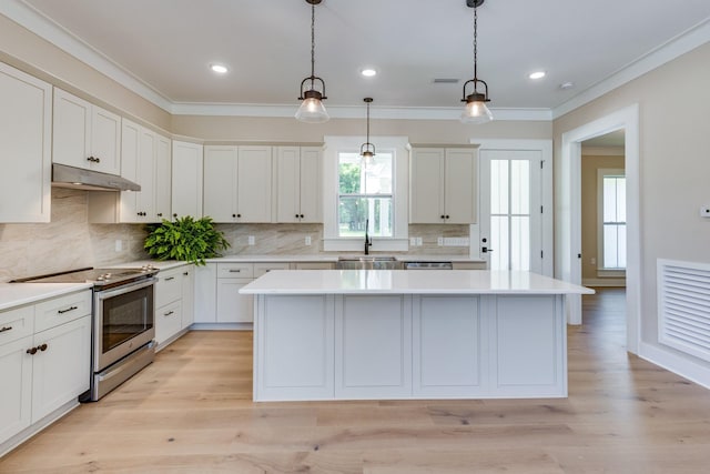 110 4th Ave S, Loretto, TN 38469 - kitchen featuring electric stove, under cabinet range hood, a sink, a center island, and ornamental molding