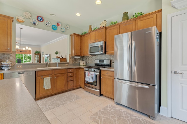 565 Scout Dr, Mount Juliet, TN 37122 - kitchen featuring appliances with stainless steel finishes, a sink, a chandelier, light tile patterned flooring, and ornamental molding