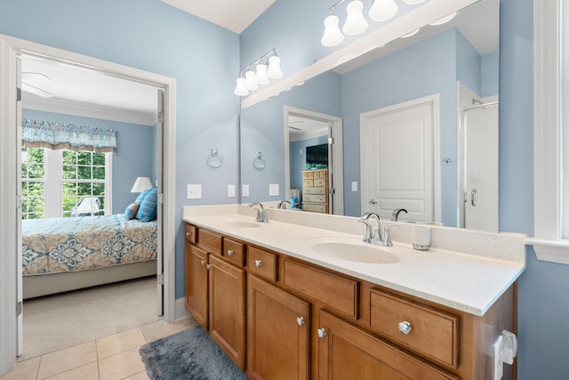 565 Scout Dr, Mount Juliet, TN 37122 - bathroom with connected bathroom, double vanity, tile patterned floors, a shower with shower door, and baseboards