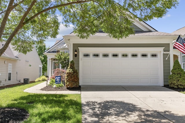 565 Scout Dr, Mount Juliet, TN 37122 - view of front facade with driveway, cooling unit, a shingled roof, and a front lawn