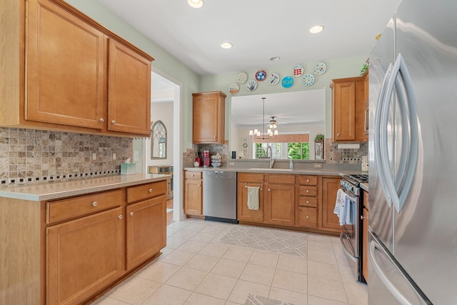 565 Scout Dr, Mount Juliet, TN 37122 - kitchen with appliances with stainless steel finishes, a sink, decorative backsplash, light tile patterned floors, and recessed lighting