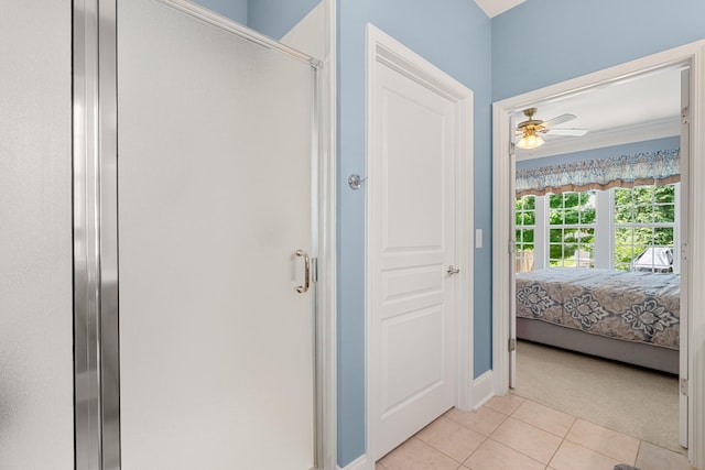 565 Scout Dr, Mount Juliet, TN 37122 - ensuite bathroom featuring a stall shower, tile patterned floors, ceiling fan, and baseboards