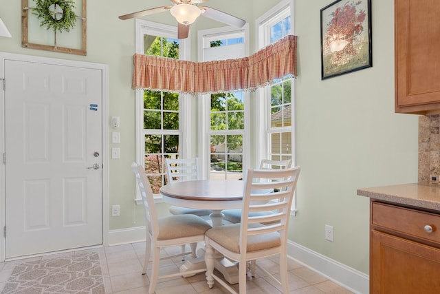 565 Scout Dr, Mount Juliet, TN 37122 - dining area with baseboards, ceiling fan, light tile patterned floors, and a towering ceiling