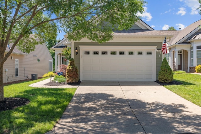 565 Scout Dr, Mount Juliet, TN 37122 - view of front of home with driveway, an attached garage, a front lawn, and central AC