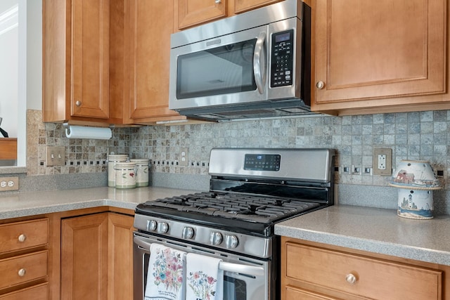 565 Scout Dr, Mount Juliet, TN 37122 - kitchen with appliances with stainless steel finishes, light countertops, and tasteful backsplash