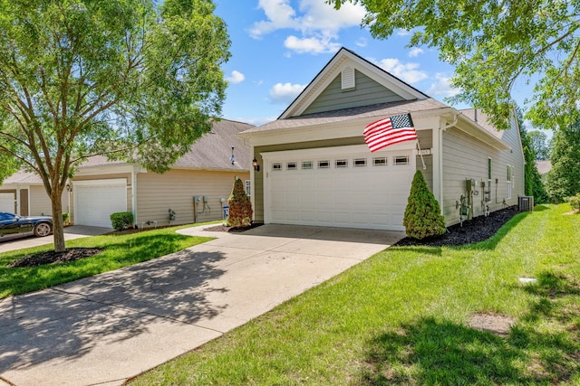 565 Scout Dr, Mount Juliet, TN 37122 - view of front of house featuring a front lawn, a garage, cooling unit, and driveway