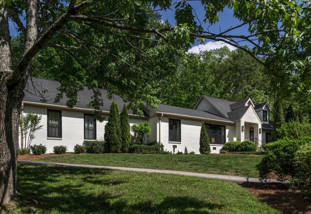 2300 Chickering Ln, Nashville, TN 37215 - view of front facade with brick siding, a front lawn, and roof with shingles