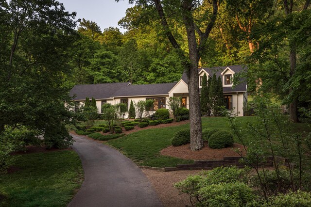 2300 Chickering Ln, Nashville, TN 37215 - view of front facade with a front yard and a forest view