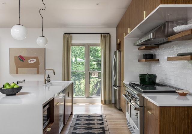 2300 Chickering Ln, Nashville, TN 37215 - kitchen featuring stainless steel appliances, brown cabinets, a sink, open shelves, and decorative backsplash