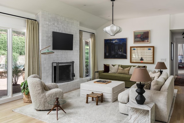 2300 Chickering Ln, Nashville, TN 37215 - living area with wood finished floors, vaulted ceiling, and a fireplace