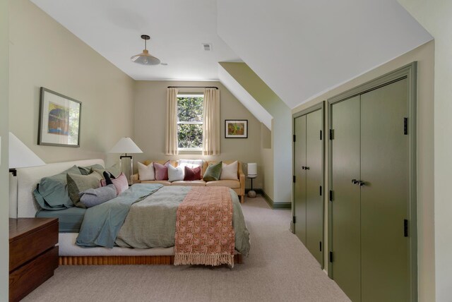 2300 Chickering Ln, Nashville, TN 37215 - carpeted bedroom with two closets, vaulted ceiling, and baseboards