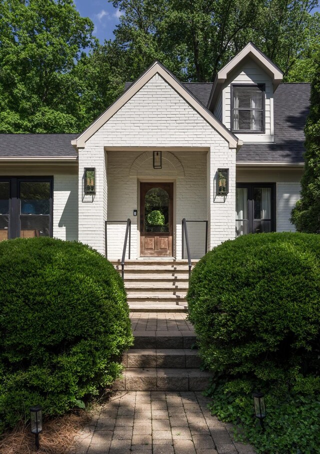2300 Chickering Ln, Nashville, TN 37215 - view of front facade with brick siding, covered porch, and a shingled roof