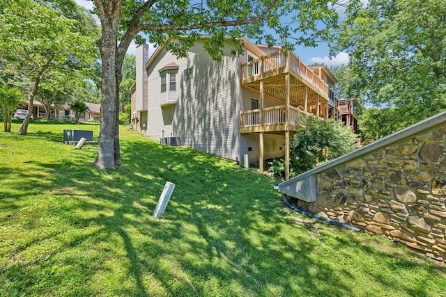 804 Beazer Ln, Antioch, TN 37013 - view of side of home with a yard, a deck, a chimney, and central air condition unit