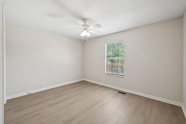 804 Beazer Ln, Antioch, TN 37013 - unfurnished room featuring wood finished floors, a ceiling fan, baseboards, and a textured ceiling