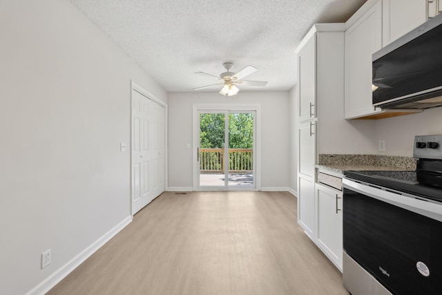 804 Beazer Ln, Antioch, TN 37013 - kitchen featuring appliances with stainless steel finishes, light wood-style floors, ceiling fan, white cabinetry, and a textured ceiling