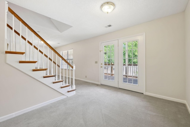804 Beazer Ln, Antioch, TN 37013 - foyer with carpet floors, baseboards, and stairs
