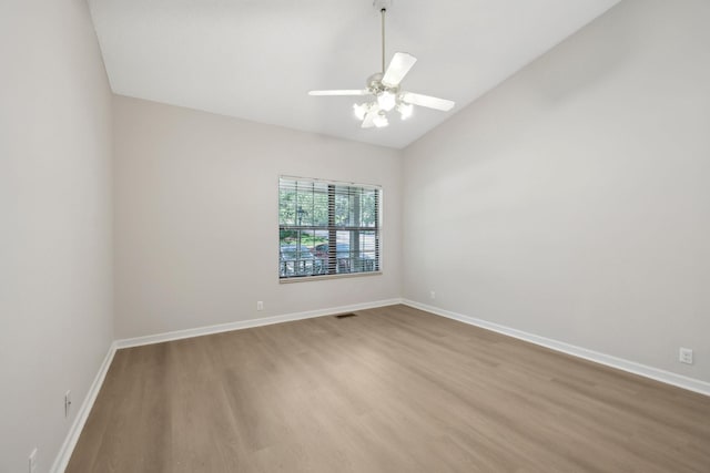 804 Beazer Ln, Antioch, TN 37013 - unfurnished room with wood finished floors, vaulted ceiling, baseboards, and a ceiling fan