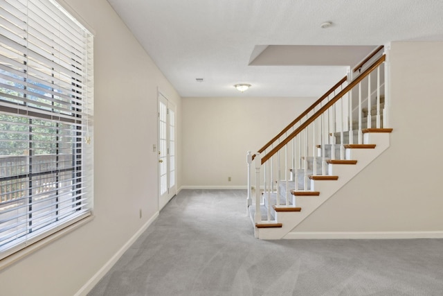 804 Beazer Ln, Antioch, TN 37013 - carpeted foyer entrance featuring plenty of natural light, baseboards, and stairway