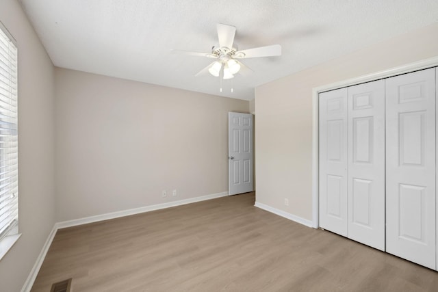 804 Beazer Ln, Antioch, TN 37013 - unfurnished bedroom with light wood-type flooring, a closet, baseboards, and ceiling fan