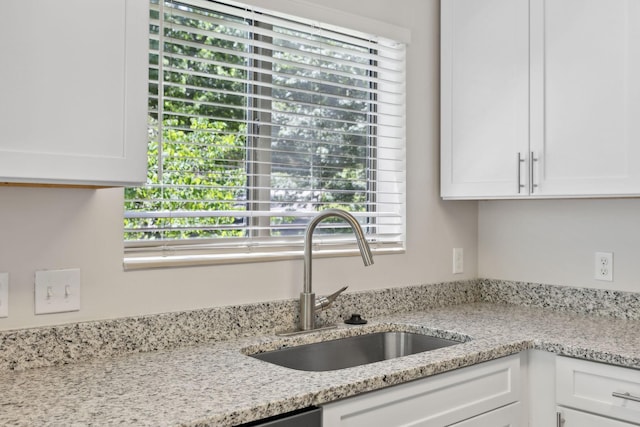 804 Beazer Ln, Antioch, TN 37013 - kitchen with a sink, white cabinetry, and light stone countertops