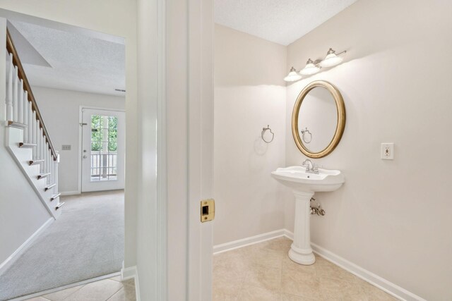 804 Beazer Ln, Antioch, TN 37013 - bathroom with tile patterned floors, a textured ceiling, and baseboards