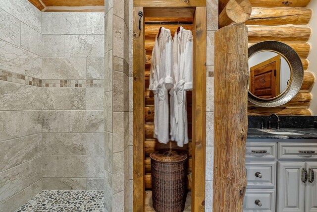 562 Rocky Ridge Rd E, Rock Island, TN 38581 - bathroom featuring vanity and tiled shower